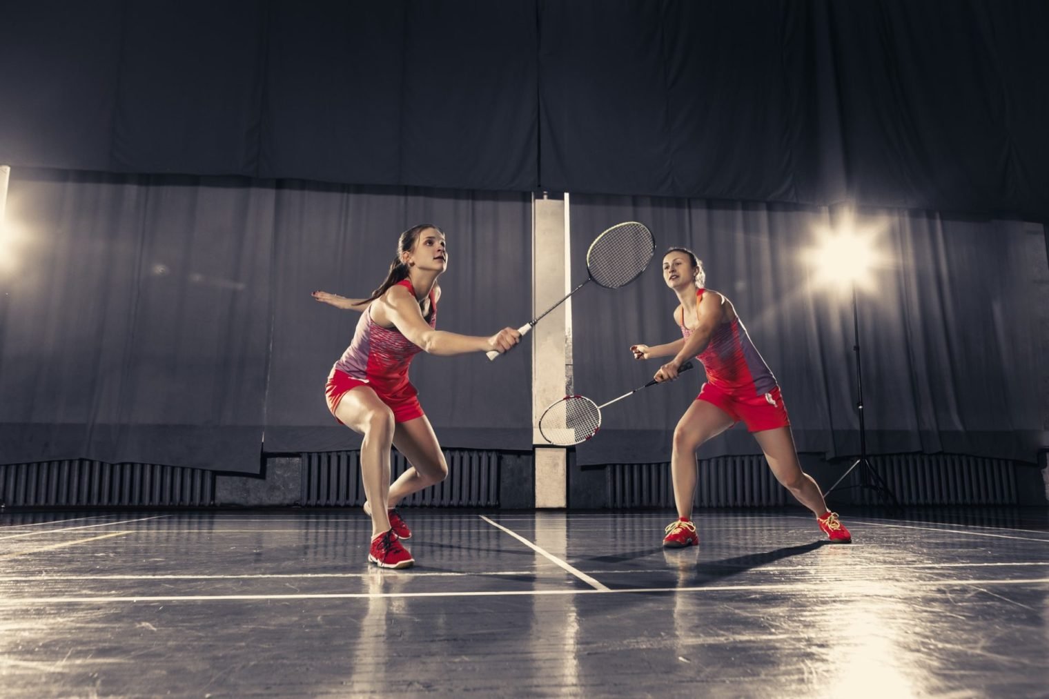 Young women playing badminton